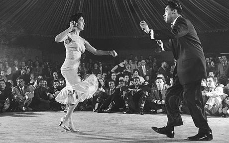 Professional Cuban dance team known as P...Professional Cuban dance team known as Pete &amp; Millie showing off fancy variations of newest dance craze, the Mambo, at the Palladium ballroom as enthusiastists watch from the sidelines.  (Photo by Yale Joel//Time Life Pictures/Getty Images)
